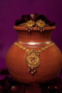 Temple Design Gold Necklace (26.940 gm gross / 25.285 gm net)